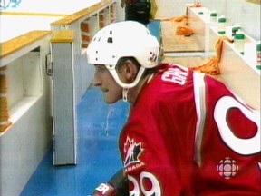 Wayne Gretzky sits alone on the bench after Team Canada's 2-1 shootout loss to the Czechs in a semifinal game at the 1998 Winter Olympics in Nagano, Japan.