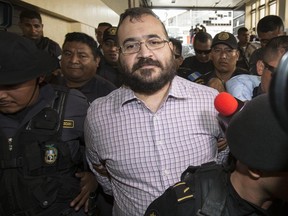 Mexico's former Veracruz state Gov. Javier Duarte arrives for a court hearing in Guatemala City, Tuesday, June 27, 2017. Duarte, who is accused of running a ring that allegedly pilfered from state coffers faces possible extradition back to Mexico. (AP Photo/Moises Castillo)