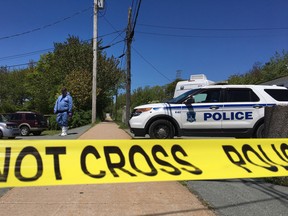 Forensic officers with Halifax Regional Police searched for evidence on a Dartmouth footpath, Wednesday, June 7, 2017 after an 18-year-old woman discovered in medical distress