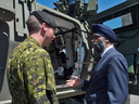 Minister of National Defence Minister Harjit Sajjan speaks with Cpl.Kevin Huard following the announcement of the Canadian Defence Review in Ottawa, Wednesday, June 7, 2017.