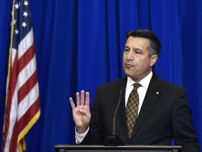 FILE - In this Thursday, Dec. 10, 2015, file photo, Nevada Gov. Brian Sandoval speaks at a news conference in Las Vegas. Governors in states that expanded Medicaid are wary of a bill revealed Thursday, June 22, 2017, by Republican leaders in the U.S. Senate. The expansion of the state-federal program has allowed 11 million lower-income Americans to gain health coverage. Among the Republicans voicing concern are Ohio Gov. John Kasich and Sandoval. (AP Photo/David Becker, File)