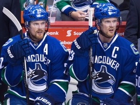 Vancouver Canucks forwards Daniel (left) and Henrik Sedin.