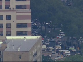 In this image taken from video provided by WNYW, police and other emergency personnel respond to Bronx Lebanon Hospital in New York after a gunman opened fire there on Friday, June 30, 2017.