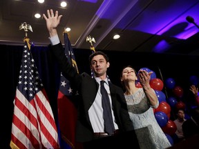 Democratic candidate for 6th congressional district Jon Ossoff, left, concedes to Republican Karen Handel while joined by his fiancee Alisha Kramer at his election night party in Atlanta, Tuesday, June 20, 2017. (AP Photo/David Goldman)