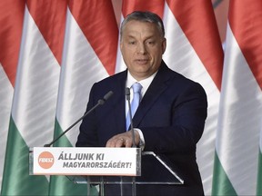 Hungarian Prime Minister Viktor Orban delivers his speech during the closing event of Fidesz - Hungarian Civic Alliance national consultation campaign titled 'Let's stand up for Hungary!' in the Balna Budapest Cultural Center in Budapest, Hungary, Tuesday, June 27, 2017. (Zoltan Mathe/MTI via AP)