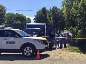 Authorities investigate a scene in Caldwell, Idaho, on Monday, June 19, 2017. Police say three people were found dead inside a home and the Canyon County Sheriff's office is investigating the deaths as possible homicides. (AP Photo/Kimberlee Kruesi)