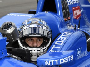 FILE - In this June 9, 2017, file photo, Tony Kanaan, of Brazil, sits in his car on pit road during an IndyCar auto race practice session at Texas Motor Speedway in Fort Worth, Texas. Kanaan feels like a veteran again this weekend at Road America. (AP Photo/Larry Papke, File)