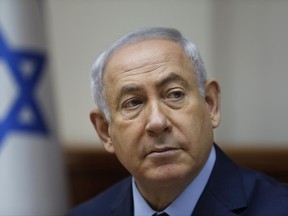 Israeli Prime Minister Benjamin Netanyahu attends the weekly cabinet meeting at his office in Jerusalem, Sunday, June 25, 2017. (Ronen Zvulun, pool via AP)