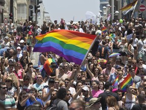 Israelis and tourists march during the Gay Pride Parade in Tel Aviv Israel Friday, June 9, 2017. About 200,000 people from the LGBT community in Israel and abroad attended in Tel Aviv's annual gay pride parade.