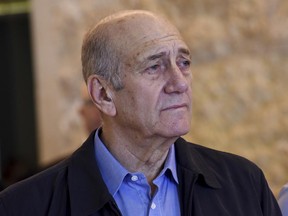 FILE -- In this Dec. 29, 2015 file photo, former Israeli Prime Minister Ehud Olmert leaves the courtroom of the Supreme Court after the court ruled on his appeal in the Holyland corruption case in Jerusalem. A spokesman for Israel's Prison Service says imprisoned former Prime Minister Ehud Olmert was evacuated to hospital after feeling unwell. (Debbie Hill/Pool File Photo via AP)