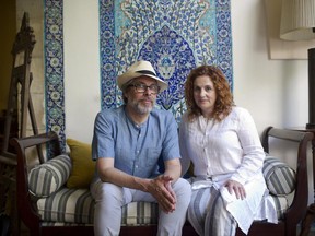 In this June 18, 2017 photo, authors Michael Chabon, left, and Ayelet Waldman pose for a photo at the launch of a new book of essays titled "Kingdom of Olive and Ash" that describes the Israeli occupation of the West Bank, now in its 50th year, in Jerusalem. A group of renowned authors has published a collection of essays about Israel's occupation of the West Bank, hoping their grim firsthand perspectives will draw attention to what they describe as 50 years of oppressive and dehumanizing conditions (AP Photo/Oded Balilty)