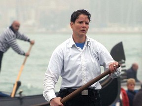 Alex Hai is seen as he rows on a gondola in Venice in an undated file photo. Hai, a gondolier who made headlines a decade ago for being Venice's first official female gondolier has announced he is transgender. Alex Hai made the revelation Wednesday, June 21, 2017, on Facebook and in a lengthy interview on Radiolab. (Andrea Merola/ANSA via AP)