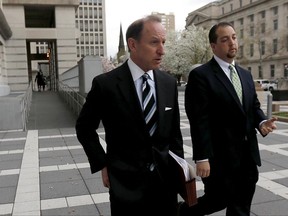 FILE- In this April 22, 2015, file photo, Abbe Lowell, left, attorney for U.S. Sen. Bob Menendez, walks out of Martin Luther King Jr. Federal Court with Menendez' press secretary Steve Sandberg following a pretrial hearing for the senator in Newark, N.J. Jared Kushner, the son-in-law of President Donald Trump, has picked Lowell to represent him in Russia-related investigations before Congress and Special Counsel Robert Mueller. Kushner has not been accused of wrongdoing, and there's no indication he's at risk of being charged. (AP Photo/Julio Cortez, File)