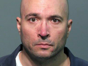 John Neumann Jr., seen here in a 2010 booking photo after he was arrested for marijuana possession, killed five co-workers then himself on Monday.