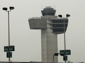An air traffic control tower stands at John F. Kennedy International Airport in N.Y.C.