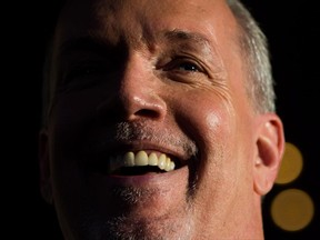 British Columbia Premier-designate, NDP Leader John Horgan smiles while speaking outside Government House after meeting with Lt-Gov. Judith Guichon in Victoria, B.C., on Thursday, June 29, 2017. THE CANADIAN PRESS/Darryl Dyck