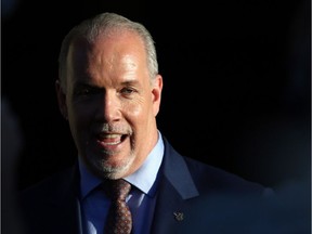 NDP leader and Premier-designate John Horgan makes a brief statement and answers questions from the media after meeting with Lt.-Gov. Judith Guichon at the Government House in Victoria, B.C., on Thursday, June 29, 2017. THE CANADIAN PRESS/Chad Hipolito ORG XMIT: CAH711