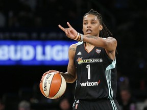 FILE - In this June 7, 2017 file photo, New York Liberty guard Shavonte Zellous (1) gestures in the second half of an WNBA basketball game against the Atlanta Dream in New York. Zellous is thrilled that the New York Liberty will have a float in Sunday's pride parade, the first for a sports franchise in the city. "I'm excited. I haven't been in a pride parade before, so I think I'm more excited than most," said Zellous, a guard who wore rainbow-colored shoes Friday night, June 23 for the Liberty's pride game. (AP Photo/Kathy Willens, File)