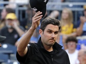Umpire John Tumpane is recognized before a baseball game between the Pittsburgh Pirates and the Tampa Bay Rays in Pittsburgh on Thursday, June 29, 2017, the day after he and two other people clung to woman he saw hop over a railing on the Roberto Clemente Bridge over the Allegheny River near the baseball stadium Wednesday. (AP Photo/Gene J. Puskar)