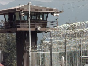 A watchtower oversees the Kent prison complex and augments the razor wire security fence.