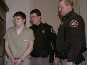 FILE - In a Friday, March 3, 2006 file photo, Brendan Dassey is escorted out of a Manitowoc County Circuit courtroom, in Manitowoc, Wis. A three-judge panel from the 7th Circuit on Thursday, June 22, 2017 affirmed that Dassey, a Wisconsin inmate featured in the Netflix series "Making a Murderer" was coerced into confessing and should be released from prison. Dassey was sentenced to life in prison in 2007 in photographer Teresa Halbach's death two years earlier.  (AP Photo/Morry Gash, File)