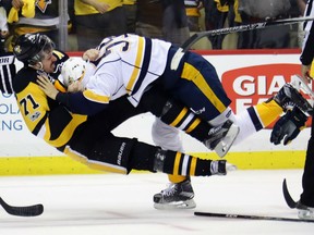 Evgeni Malkin, left, of the Pittsburgh Penguins is sent flying to the ice courtesy of Nashville Predators' Roman Jossi during Game 5 action in the Stanley Cup Final Thursday in Pittsburgh. Malkin had a goal and assist as the Pens prevailed 6-0 to take a 3-2 lead in the series.