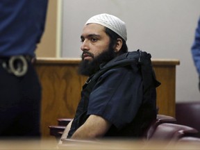 FILE - In this Dec. 20, 2016 file photo, Ahmad Khan Rahimi, the man accused of setting off bombs in New Jersey and New York's Chelsea neighborhood in September, sits in court in Elizabeth, N.J.  Attorney Sabrina Shroff asked a judge Tuesday, June 20, 2017 to block the planned testimony of a government terrorism expert from Ahmad Khan Rahimi's trial. He's accused of detonating a pipe bomb in New Jersey and planting two bombs in Manhattan. (AP Photo/Mel Evans, File)