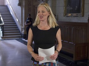 Minister of Environment and Climate Change Catherine McKenna walks to a news conference in the Foyer of the House of Commons in Ottawa, Thursday June 15, 2017.