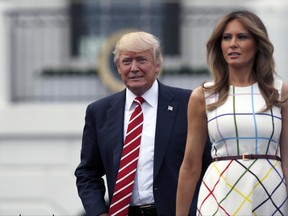 In this June 22, 2017, photo, President Donald Trump with first lady Melania Trump arrives at the Congressional Picnic on the South Lawn of the White House in Washington. Melania Trump ended her estrangement from Washington when she moved to the White House earlier this month and reunited with President Donald Trump after nearly five months apart. So what's next now that she's finally here? The below-the-radar first lady packed quite a bit into her first weeks as a full-timer at the White House, without being overtly public about it. (AP Photo/Alex Brandon)