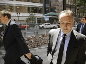 Barry Cadden, president of the New England Compounding Center, along with members of his legal team, arrive at the federal courthouse for sentencing Monday, June 26, 2017, in Boston. A verdict of guilty on charges of mail fraud, racketeering conspiracy and racketeering had been reached on Wednesday, March 22, 2017 in the case of a fungal meningitis outbreak from tainted steroids manufactured by Cadden's pharmacy which killed dozens and sickened hundreds of people in 2012. (AP Photo/Stephan Savoia)