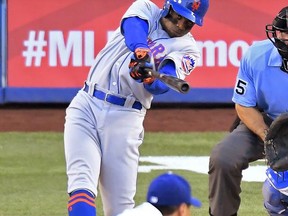 New York Mets' Curtis Granderson, top, hits a solo home run off Los Angeles Dodgers starting pitcher Hyun-Jin Ryu, of South Korea, during the first inning of a baseball game, Thursday, June 22, 2017, in Los Angeles. (AP Photo/Mark J. Terrill)
