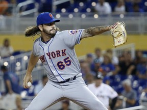 New York Mets' Robert Gsellman delivers a pitch during the first inning of a baseball game against the Miami Marlins, Tuesday, June 27, 2017, in Miami. (AP Photo/Wilfredo Lee)