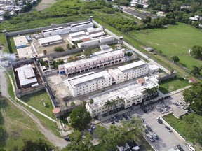 This photo released by the Tamaulipas state security spokesperson's office via Twitter and taken from a federal police helicopter shows the "Cedes" prison where authorities say two police were killed and another was wounded in Ciudad Victoria, Mexico, Tuesday, June 6, 2017. Authorities closed nearby roads, and surrounding areas were under an evacuation alert.