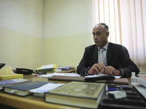 In this June 1, 2017 photo, judge Jehad al-Duradi, who deals with sexual violence cases in Jordan, speaks in an interview in his office in Amman, Jordan. Jordan is on the verge of repealing an article in its penal code that allows a rapist to escape punishment if he marries his victim. Women's activists say this would be a victory, but that much work lies ahead and that women still suffer under patriarchal customs and a legal system that fails to protect victims. (AP Photo/Omar Akour)