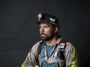 In this undated photo provided by Lauren Burden, coal miner Rickey Thorpe poses for a photo in his work clothes. The photo was taken for his mom as a Mother's Day gift. Thorpe, who worked at Sebree's Onton No. 9 mine in western Kentucky, was killed in a mechanical accident at the underground mine on Sept. 16, 2015. Thorpe's mother, Kathy Bartlett, is critical of a new law in Kentucky that reduces safety inspections at underground mines. (Lauren Burden via AP)