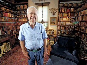 In this July 4, 2014 photo, Forrest Fenn poses at his Santa Fe, N.M., home. New Mexico's top law enforcement officer is asking Fenn, the author and antiquities dealer who inspired thousands to comb remote corners of the West in vain for a chest of gold and jewels to end the treasure hunt. The plea from New Mexico State Police Chief Pete Kassetas follows what authorities believe is the latest death related to the hunt for Fenn's hidden treasure. (Luis Sanchez Saturno/Santa Fe New Mexican via AP)