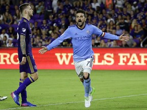 FILE - In this Sunday, May 21, 2017 file photo, New York City FC's David Villa (7) celebrates his second-half goal as he runs past Orlando City's Leo Pereira, left, in an MLS soccer game in Orlando, Fla. It's Rivalry Week for Major League Soccer with three marquee matchups set for this weekend. The Hudson River Derby between the Red Bulls and NYCFC on Saturday, June 24, 2017 has been grabbing much of the attention. (AP Photo/John Raoux, File)