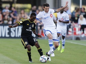 Columbus Crew's Harrison Afful, left, and Montreal Impact's Ignacio Piatti vies for the ball during the first half of an MLS soccer match Saturday, June 24, 2017, in Columbus, Ohio. (AP Photo/Jay LaPrete)