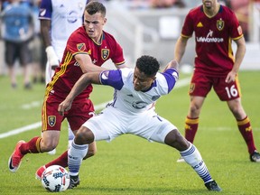 Real Salt Lake forward Brooks Lennon, left, and Orlando City SC midfielder Cristian Higuita (7) go for the ball during an MLS soccer game in Sandy, Utah, Friday, June 30, 2017. (Chris Detrick/The Salt Lake Tribune via AP)