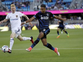 San Jose Earthquakes forward Danny Hoesen (9) shoots next to Real Salt Lake defender Justen Glad during the first half of an MLS soccer match Saturday, June 24, 2017, in San Jose, Calif. (AP Photo/Marcio Jose Sanchez)