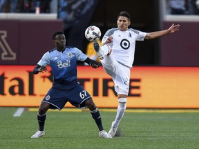 Minnesota United defender Kevin Venegas, right, and Vancouver Whitecaps forward Alphonso Davies (67) compete for the ball during the second half of an MLS soccer match Saturday, June 24, 2017, in Minneapolis. (Aaron Lavinsky/Star Tribune via AP)