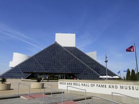 FILE – This April 24, 2016, file photo shows the Rock and Roll Hall of Fame and Museum, located on the shores of Lake Erie in downtown Cleveland. The museum is opening a $15 million "Power of Rock" exhibit July 1, 2017, that will give fans a taste of the hall's famous induction ceremonies.  The exhibit will feature a 12-minute reel of ceremony highlights by Academy Award-winning director Jonathan Demme. (AP Photo/Beth J. Harpaz, File)