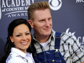 FILE - In this April 3, 2011, file photo, Joey Feek, left, and her husband Rory Feek, of "Joey + Rory," arrive at the Annual Academy of Country Music Awards in Las Vegas. Rory Feek  announced he will perform publicly for the first time since his wife Joey died last year to raise funds for the Music Health Alliance, a nonprofit that helped his family with insurance and medical bills. (AP Photo/Chris Pizzello, File)