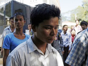 Self-styled exorcist Tun Naing, center, arrives at a district court in Thanlyin township, south of Yangon, Myanmar