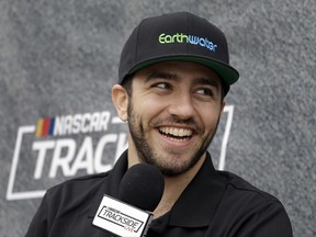 Israeli driver Alon Day smiles during an interview prior to racing in the NASCAR Sprint Cup Series auto race Sunday, June 25, 2017, in Sonoma, Calif. (AP Photo/Ben Margot)