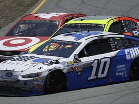 Danica Patrick (10) turns into Dale Earnhardt Jr., center, and Kyle Larson on turn seven during the NASCAR Sprint Cup Series auto race Sunday, June 25, 2017, in Sonoma, Calif. (AP Photo/Ben Margot)