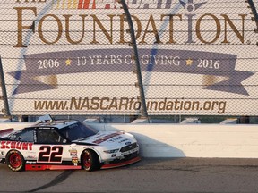 Sam Hornish Jr. sits in his car after hitting the wall during the NASCAR Xfinity Series auto race, Saturday, June 24, 2017, at Iowa Speedway in Newton, Iowa. (AP Photo/Charlie Neibergall)