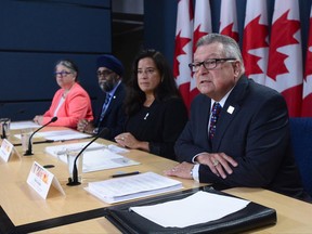 Ralph Goodale, Minister of Public Safety and Emergency Preparedness, Jody Wilson-Raybould, Minister of Justice, Harjit Sajjan, Minister of National Defence, and Diane Lebouthillier, Minister of National Revenue, make a national security-related announcement at the National Press Theatre in Ottawa on Tuesday, June 20, 2017. THE CANADIAN PRESS/Sean Kilpatrick