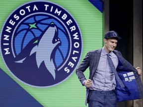 Lauri Markkanen reacts after being selected by the Minnesota Timberwolves as the seventh pick overall during the NBA basketball draft, Thursday, June 22, 2017, in New York. (AP Photo/Frank Franklin II)