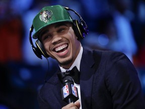 Duke's Jayson Tatum answers questions during an interview after being selected by the Boston Celtics as the third pick overall during the NBA basketball draft, Thursday, June 22, 2017, in New York. (AP Photo/Frank Franklin II)